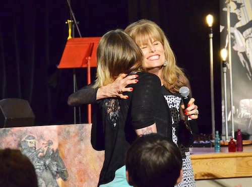 Donna Clark Love with Stand4Love hugging a member of a congregation at a rural church. This is part of STAND4Love training or workshops